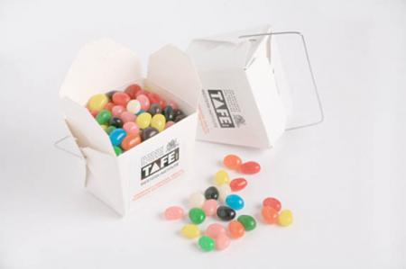 WHITE CARDBOARD NOODLE BOX FILLED WITH JELLY BEANS